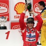 Brazilian Formula One driver Ayrton Senna pours champagne over himself on March 28, 1993 celebrating his victory in the Brazilian Grand Prix, Sao Paulo. This was Senna's 37th Grand Prix victory, but only his second win in Brazil. In back is German driver Michael Schumacher.