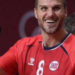Norway's right winger Kristian Bjornsen (L) and Norway's pivot Bjarthe Myrhol celebrate after scoring during the men's preliminary round group A handball match between Norway and France of the Tokyo 2020 Olympic Games at the Yoyogi National Stadium in Tokyo on August 1, 2021.