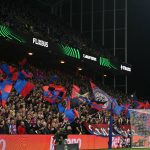 Palace fans fly flags near the end of the UEFA Conference semi-final second-leg football match between Crystal Palace and Shakhtar Donetsk at Selhurst Park in London on May 7, 2026.