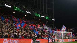 Palace fans fly flags near the end of the UEFA Conference semi-final second-leg football match between Crystal Palace and Shakhtar Donetsk at Selhurst Park in London on May 7, 2026.