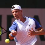 PARIS, FRANCE - MAY 25: Marton Fucsovics of Hungary plays a forehand during his Men's Singles first round match against Matteo Berrettini of Italy on Day Two of the 2026 French Open at Roland Garros on May 25, 2026 in Paris, France. (Photo by Matthew Stockman/Getty Images)