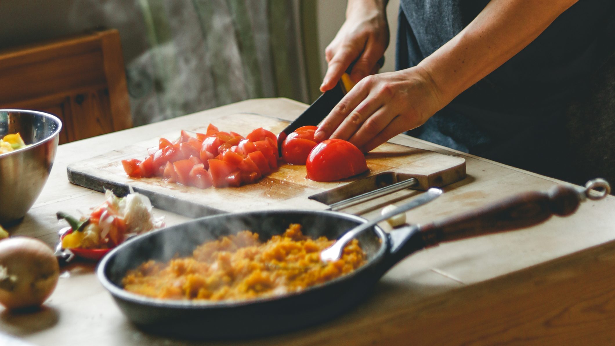 a candid shot of an adult cooking healthy food