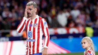 Atletico Madrid's French forward #07 Antoine Griezmann gets emotional next to one of his children during a farewell ceremony after the Spanish league football match between Club Atletico de Madrid and Girona FC at the Metroplitano stadium in Madrid on May 17, 2026. French forward Antoine Griezmann received a warm goodbye from the club's supporters today. Atletico's all-time top goalscorer will head to the United States to play for MLS side Orlando City.
