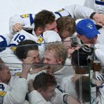 Finland's forward #94 Konsta Helenius (C) celebrates with teammates after scoring the sudden-death goal to win during the over time of the IIHF Ice Hockey Men's World Championship final match between Switzerland and Finland at the Swiss Life Arena in Zurich on May 31, 2026.