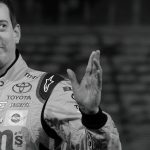 (FILES) 2015 NASCAR Sprint Cup Series Champion Kyle Busch waves as he arrives at the Toyota press conference during the 2017 North American International Auto Show in Detroit, Michigan, on January 9, 2017. NASCAR star Kyle Busch, a two-time Cup series champion regarded as one of the sport's greatest ever drivers, died May 21, 2026 aged 41, his family confirmed in a joint statement. He was in his 22nd season in NASCAR's top division and had been hospitalized earlier Thursday with an undisclosed but "severe illness".