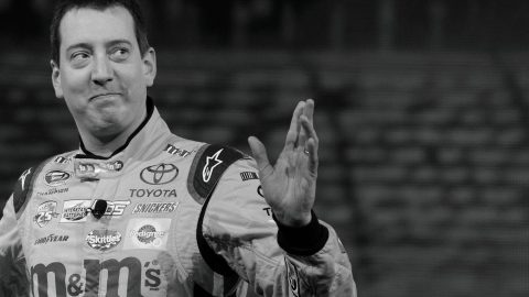 (FILES) 2015 NASCAR Sprint Cup Series Champion Kyle Busch waves as he arrives at the Toyota press conference during the 2017 North American International Auto Show in Detroit, Michigan, on January 9, 2017. NASCAR star Kyle Busch, a two-time Cup series champion regarded as one of the sport's greatest ever drivers, died May 21, 2026 aged 41, his family confirmed in a joint statement. He was in his 22nd season in NASCAR's top division and had been hospitalized earlier Thursday with an undisclosed but "severe illness".