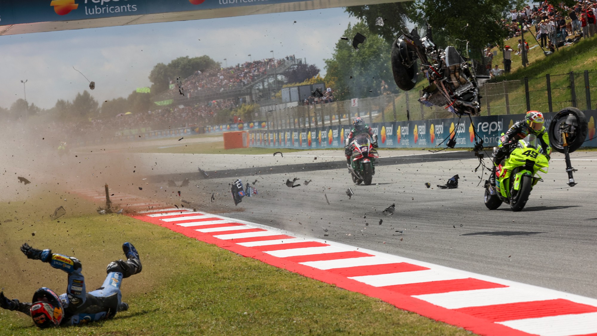 Team Gresini Racing MotoGP's Alex Marquez falls on the side of the track as he crashes during the 2026 Catalunya Moto GP Grand Prix at the Catalunya racetrack in Montmelo, near Barcelona, on May 17, 2026.