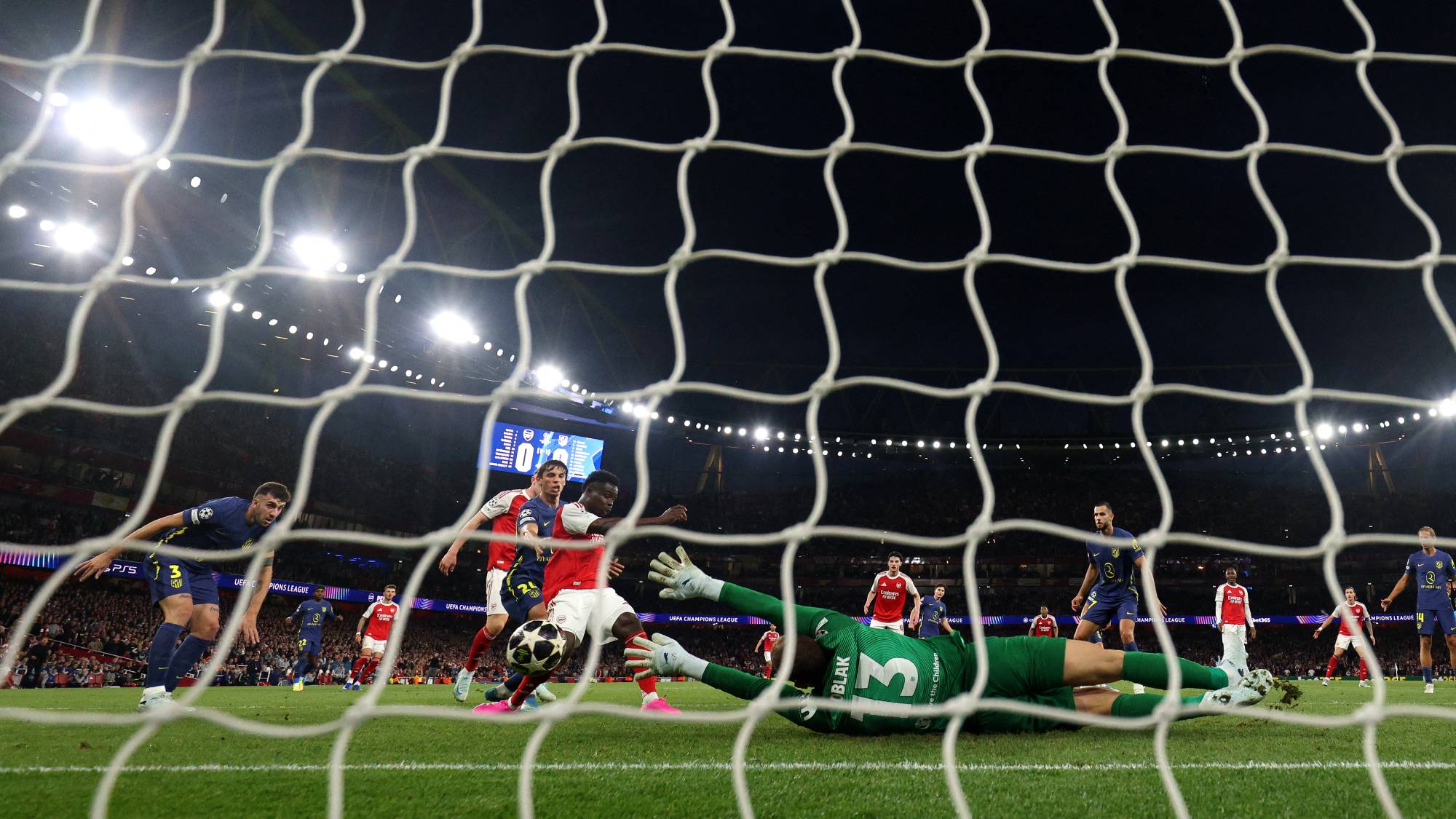 Arsenal's English midfielder #07 Bukayo Saka scores the team's first goal during the UEFA Champions League second-leg semi-final football match between Arsenal and Atletico Madrid at the Emirates Stadium in north London on May 5, 2026.
