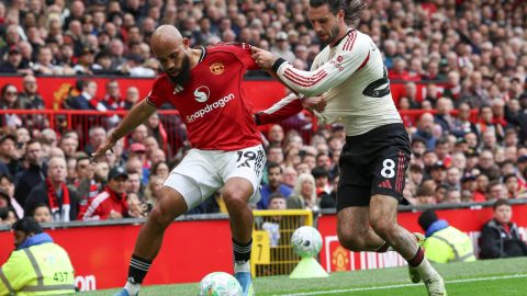 Manchester United's Cameroonian midfielder #19 Bryan Mbeumo (L) vies with Liverpool's Hungarian midfielder #08 Dominik Szoboszlai (R) during the English Premier League football match between Manchester United and Liverpool at Old Trafford in Manchester, north west England, on May 3, 2026.