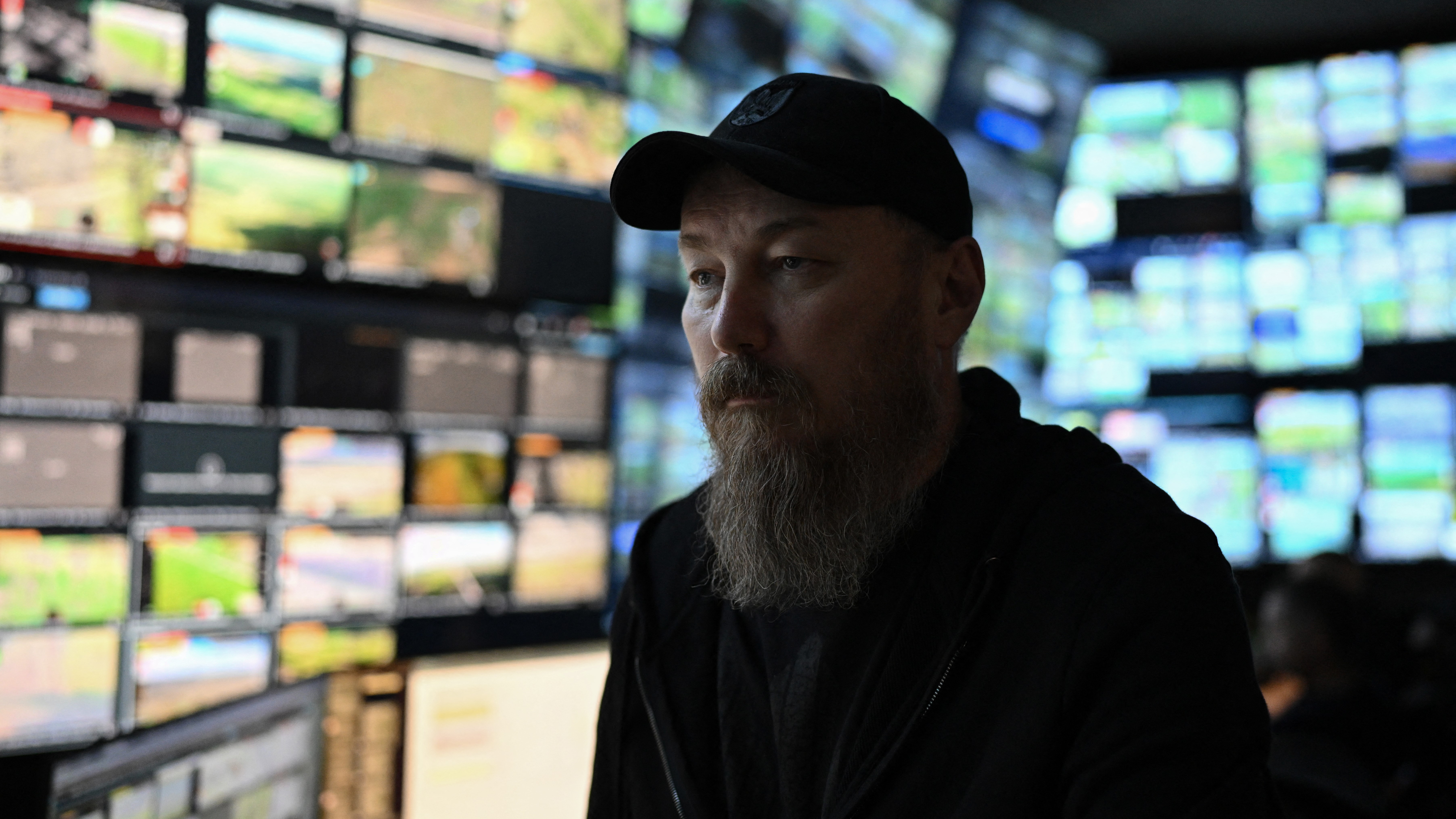This photograph taken earlier in May 2026 and published on May 17, 2026, shows the Commander of Ukraine's Unmanned Forces, Robert Brovdi, known as "Madyar", during an interview with AFP in a command post at an undisclosed location in Ukraine, amid the Russian invasion of Ukraine. From his underground post, the commander of Ukraine's unmanned forces, Robert Brovdi, known as "Madyar", has been meticulously planning increasingly frequent strikes deep into Russian territory, which he sees as retribution for Russia's invasion. (Photo by Genya SAVILOV / AFP)