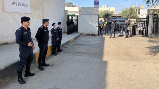 IRBID, JORDAN - SEPTEMBER 10: Police take security measures at a polling station as citizens arrive to cast their ballots for the parliamentary elections in Irbid, Jordan on September 10, 2024. Laith Al-jnaidi / Anadolu (Photo by Laith Al-jnaidi / Anadolu via AFP)
