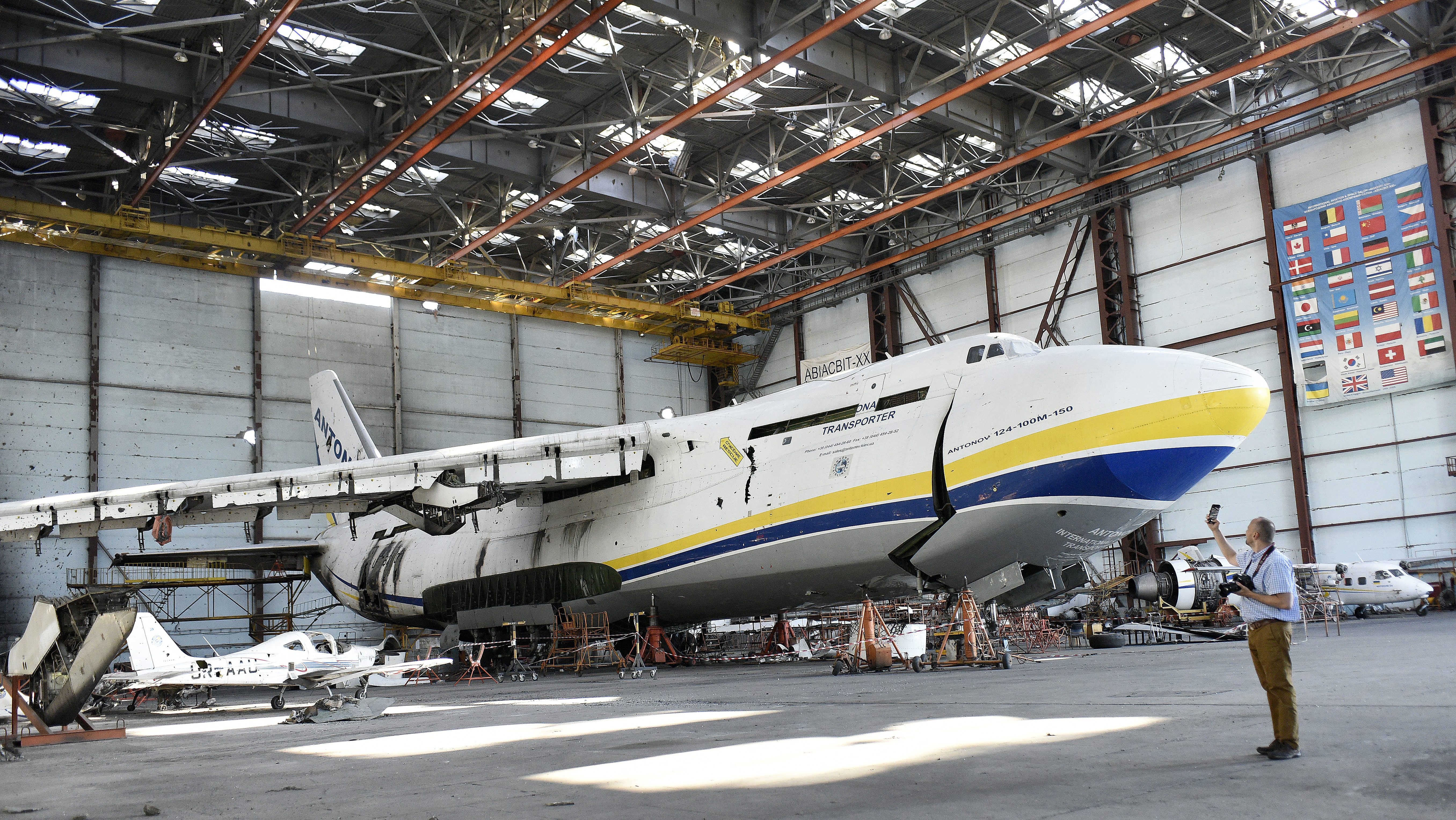 KYIV REGION, UKRAINE - AUGUST 30, 2022 - A damaged Antonov An-124-100-150 Ruslan cargo transporter is pictured on the premises of Antonov Airport, an international cargo airport that became the site of an intense battle during the 2022 Russian invasion of Ukraine, near Hostomel, Kyiv Region, northern Ukraine. NO USE RUSSIA. NO USE BELARUS. (Photo by Ruslan Kaniuka / NurPhoto via AFP)