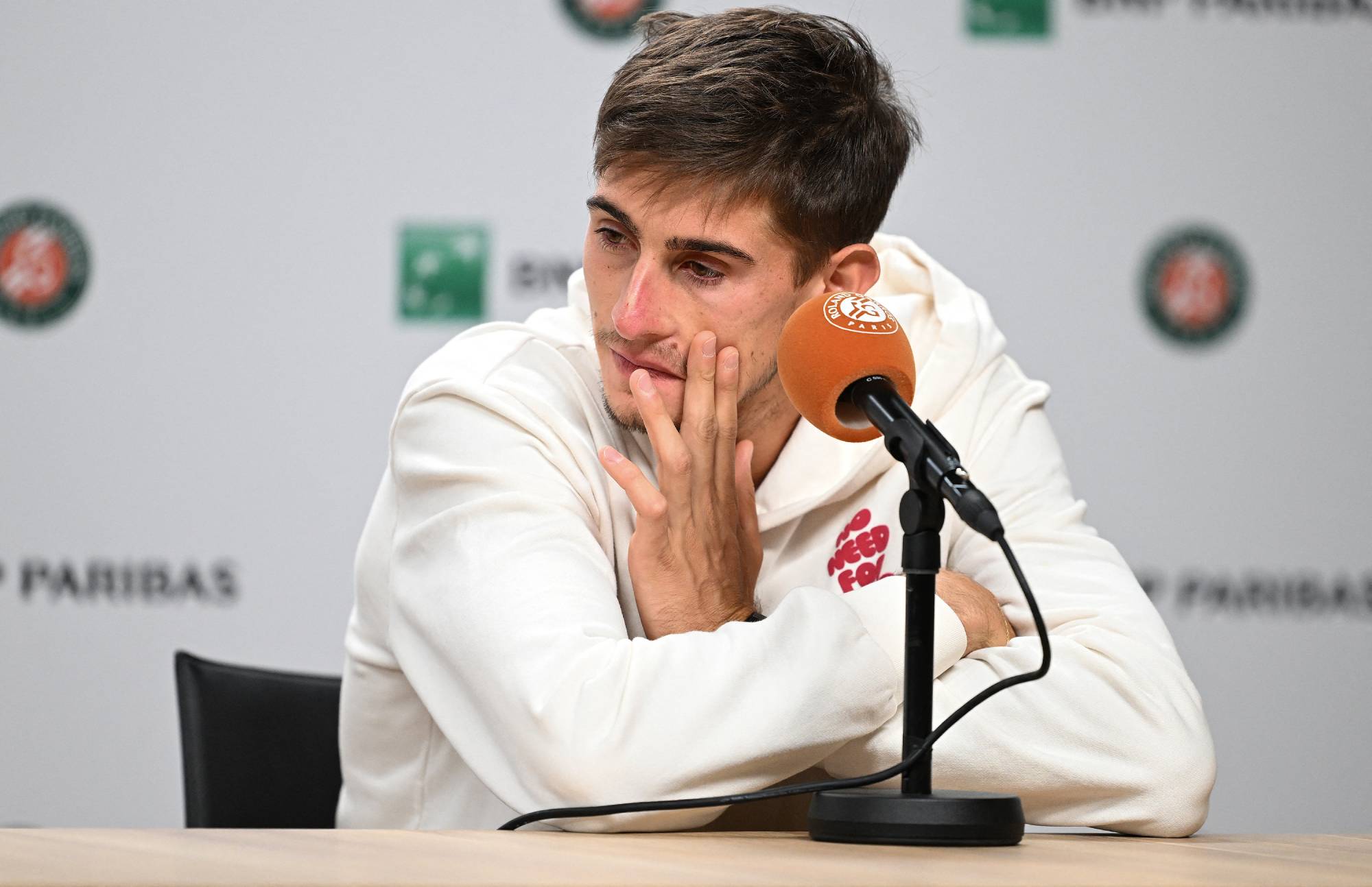 PARIS, FRANCE - JUNE 5: Matteo Arnaldi of Italy and Flavio Cobolli (not seen) of Italy attend a press conference after Matteo Arnaldi withdrew from their scheduled Men's Singles semifinal match due to health concerns on Day Thirteen of the 2026 French Open at Roland Garros on June 5, 2026 in Paris, France. Cobolli advanced to the finals to compete against Alexander Zverev. Burak Akbulut / Anadolu