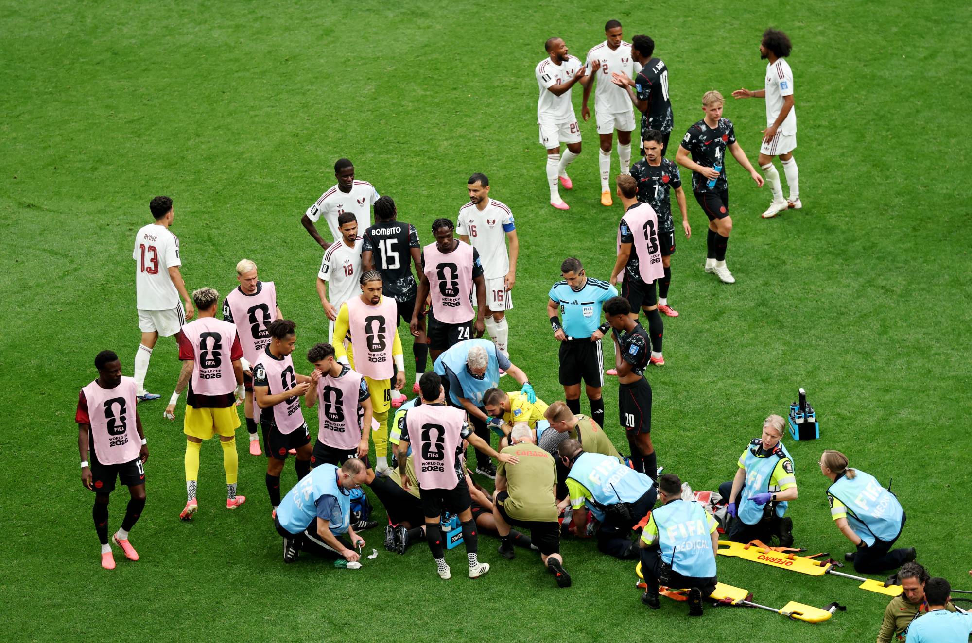 VANCOUVER, BRITISH COLUMBIA - JUNE 18: Ismael Kone #8 of Canada receives the medical attention after being fouled by Assim Madibo #23 of Qatar during the FIFA World Cup 2026 Group B match between Canada and Qatar at BC Place Vancouver on June 18, 2026 in Vancouver, British Columbia. Emilee Chinn/Getty Images/AFP