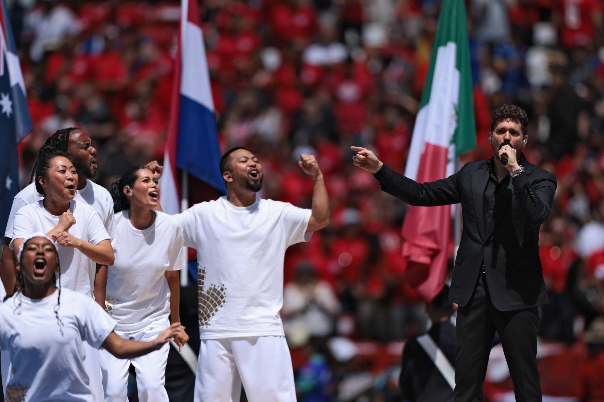 Canadian singer Michael Buble (R) performs during the opening ceremony of the 2026 World Cup football tournament ahead of the Group B football match between Canada and Bosnia and Herzegovina at Toronto Stadium in Toronto on June 12, 2026.
