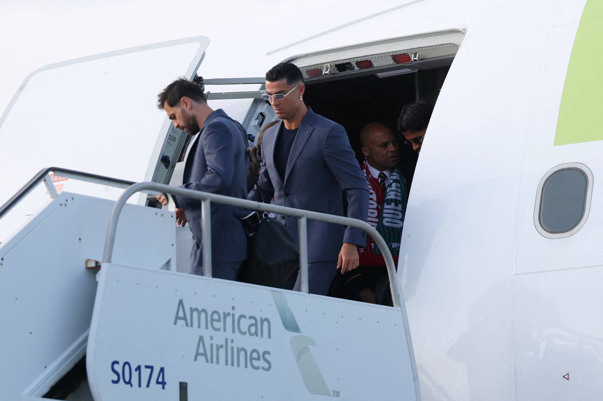 Portugal's forward #07 Cristiano Ronaldo (C) walks on the runway upon his arrival at the Palm Beach International Airport for the FIFA 2026 World Cup football tournament, in West Palm Beach, Florida on June 12, 2026.