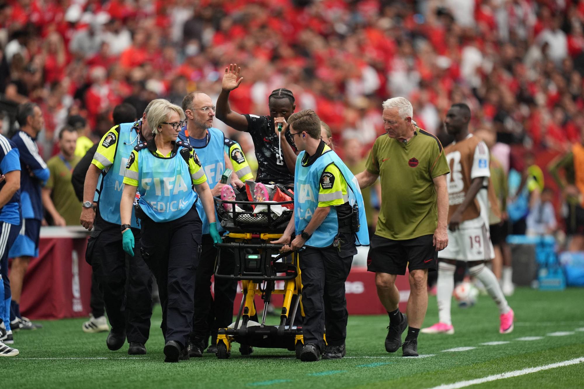VANCOUVER, CANADA - JUNE 18: Ismael Kone of Canada is assisted away after he got injured in his leg during the 2026 FIFA World Cup First Stage Group B match between Canada and Qatar at BC Place Stadium in Vancouver, Canada on June 18, 2026. Ercin Erturk / Anadolu