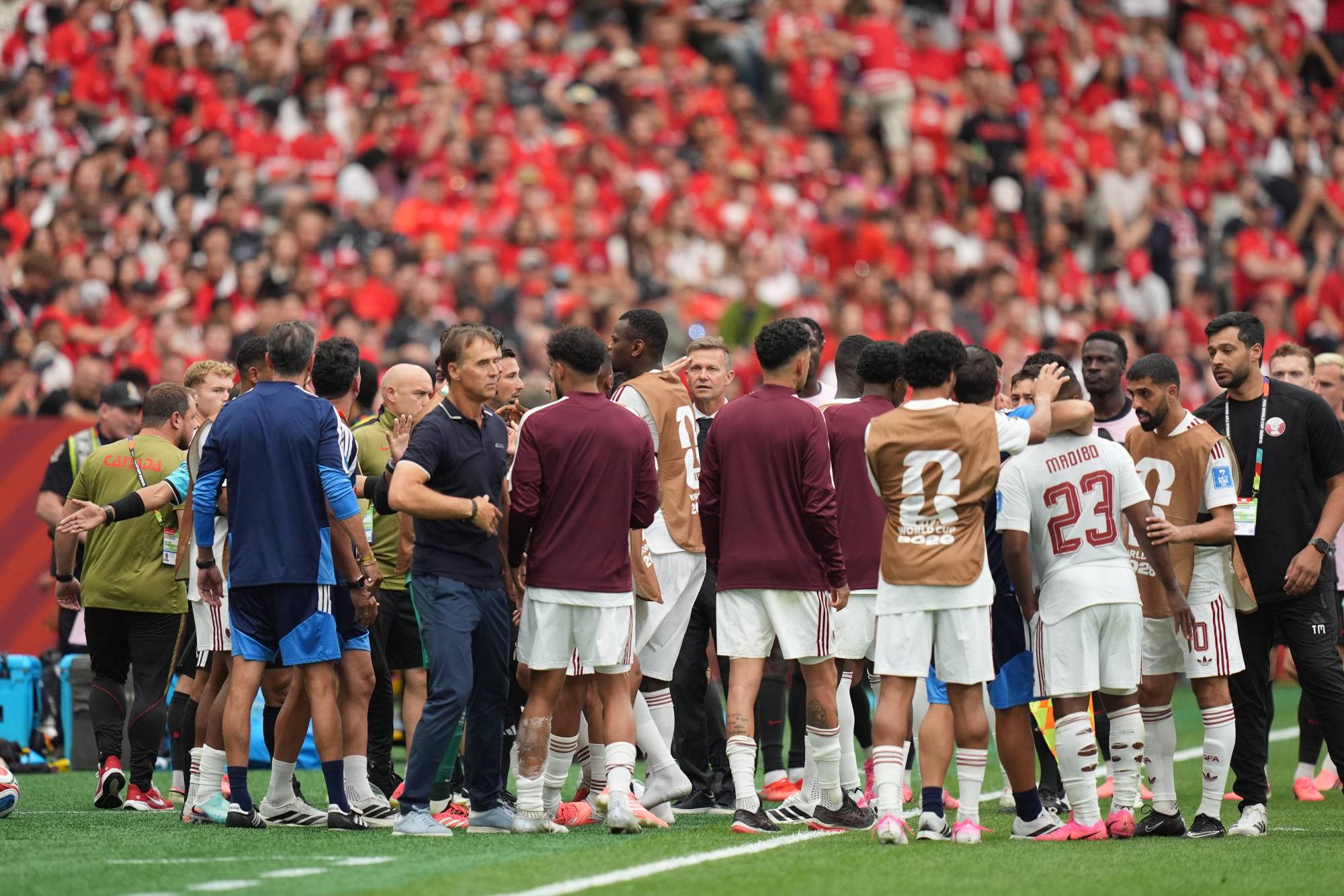 VANCOUVER, CANADA - JUNE 18: Players talk after Ismael Kone got injured in his leg during the 2026 FIFA World Cup First Stage Group B match between Canada and Qatar at BC Place Stadium in Vancouver, Canada on June 18, 2026. Ercin Erturk / Anadolu