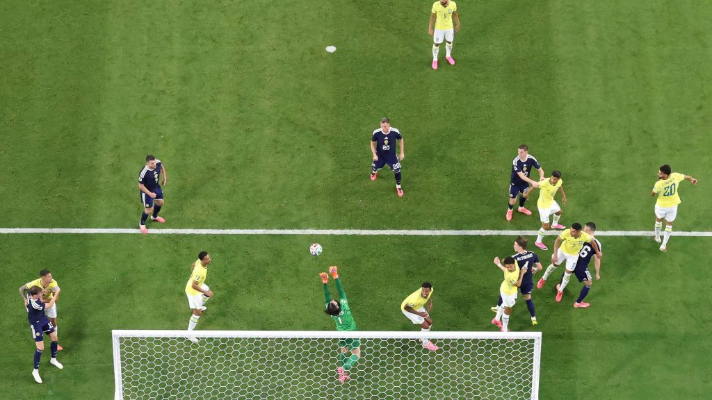 MIAMI GARDENS, FLORIDA - JUNE 24: (EDITOR'S NOTE: Image was captured using a remote camera positioned above the field of play.) Alisson #1 of Brazil makes a save during the FIFA World Cup 2026 Group C match between Scotland and Brazil at Miami Stadium on June 24, 2026 in Miami, United States. Megan Briggs/Getty Images/AFP