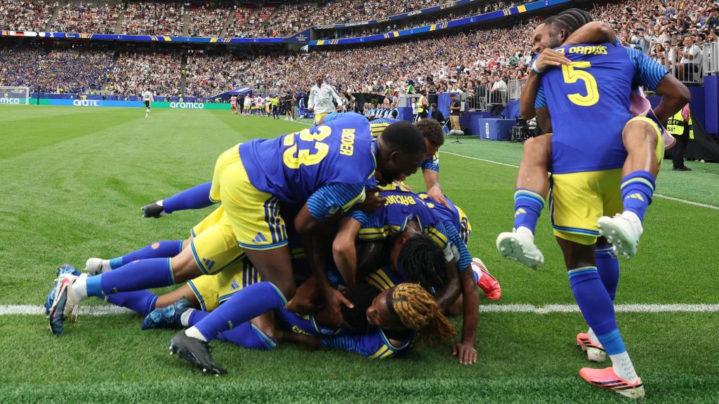 HOUSTON, TEXAS - JUNE 14: Livano Comenencia #8 of Curacao celebrates scoring his team's first goal during the FIFA World Cup 2026 Group E match between Germany and Curacao at Houston Stadium on June 14, 2026 in Houston, Texas. Alexander Hassenstein/Getty Images/AFP