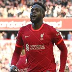Liverpool's Belgium striker Divock Origi celebrates scoring the team's second goal during the English Premier League football match between Liverpool and Everton at Anfield in Liverpool, north west England on April 24, 2022.