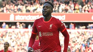 Liverpool's Belgium striker Divock Origi celebrates scoring the team's second goal during the English Premier League football match between Liverpool and Everton at Anfield in Liverpool, north west England on April 24, 2022.