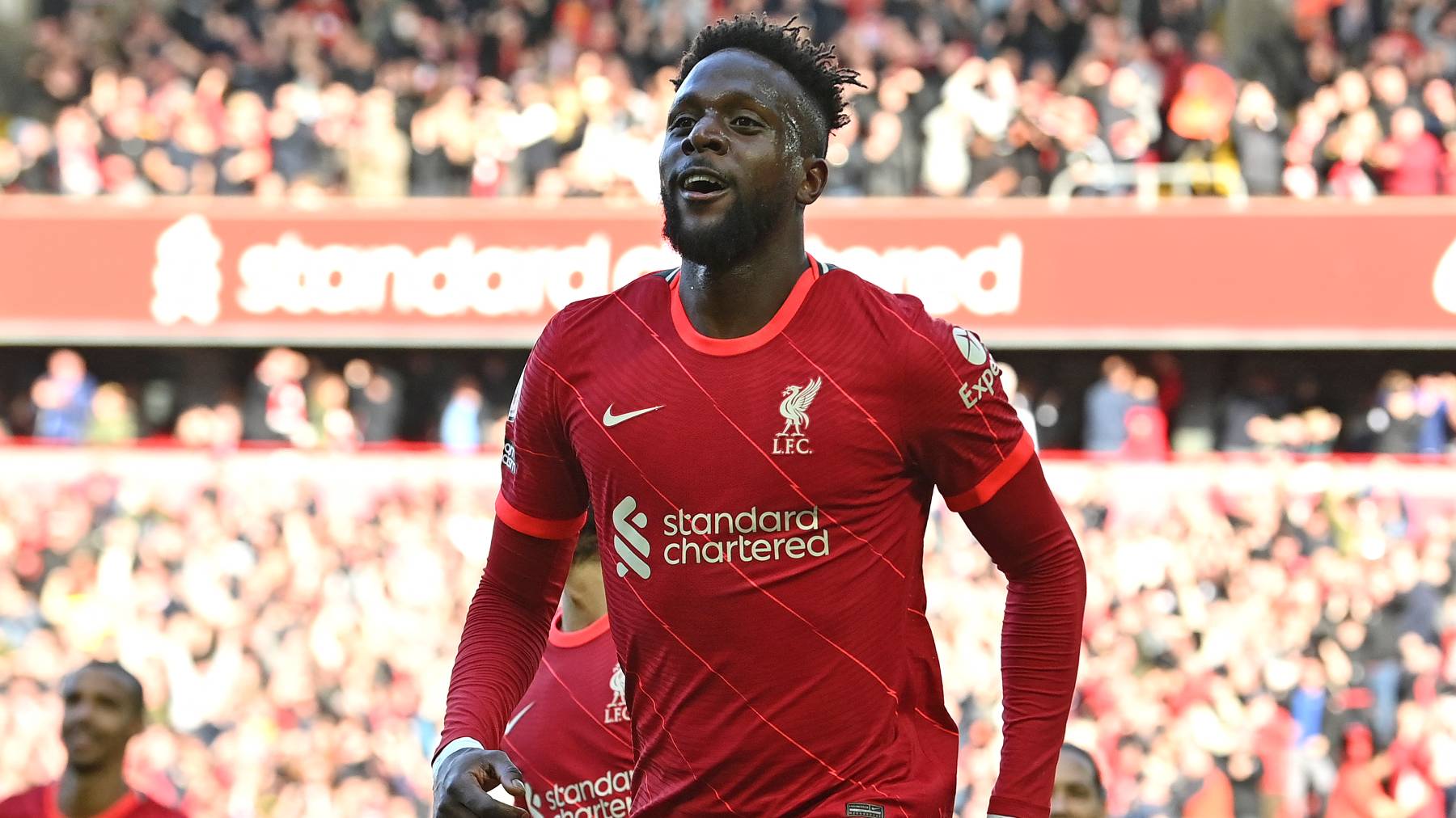 Liverpool's Belgium striker Divock Origi celebrates scoring the team's second goal during the English Premier League football match between Liverpool and Everton at Anfield in Liverpool, north west England on April 24, 2022.