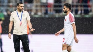 Jordan's Moroccan head coach Jamal Sellami speaks with Jordan's defender #28 Anas Badawi during a friendly match between Switzerland and Jordan ahead of the 2026 FIFA World Cup football tournament at the Kybunpark stadium, in St. Gallen on May 31, 2026.