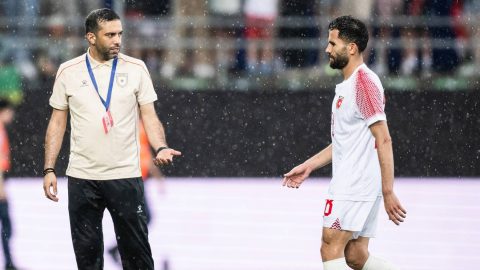 Jordan's Moroccan head coach Jamal Sellami speaks with Jordan's defender #28 Anas Badawi during a friendly match between Switzerland and Jordan ahead of the 2026 FIFA World Cup football tournament at the Kybunpark stadium, in St. Gallen on May 31, 2026.