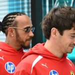 Ferrari's British driver Lewis Hamilton and Ferrari's Monegasque driver Charles Leclerc arrive for the Driver's Parade before the 2026 Miami Formula One Grand Prix at Miami International Autodrome in Miami Gardens, Florida, on May 3, 2026. Due to weather and timing, the Driver's Parade took place as a series of interviews near the garages instead of an on track parade.