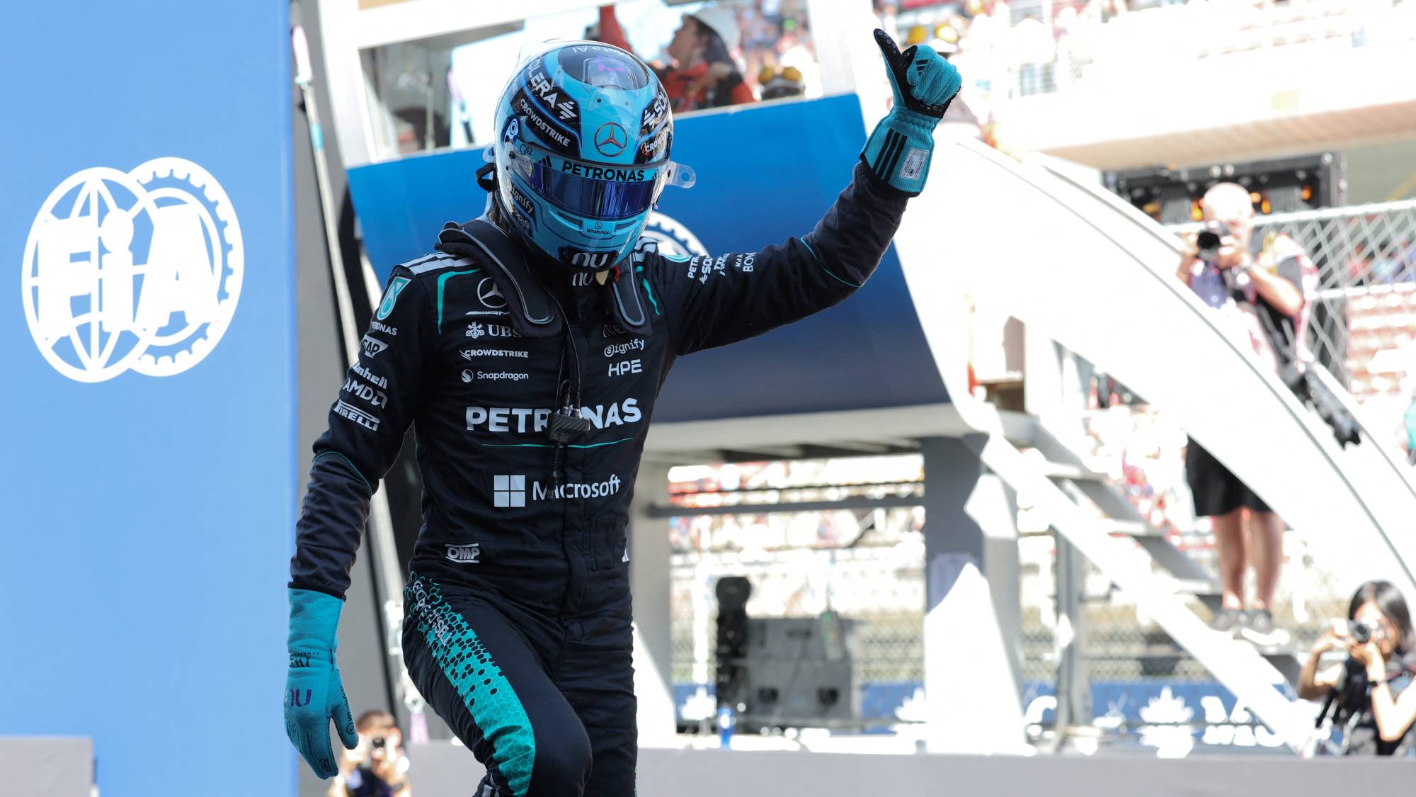 Mercedes' British driver George Russell celebrates pole position after the qualifying session at the Circuit de Catalunya ahead of the Catalonia Formula One Grand Prix in Montmelo, on the outskirts of Barcelona, on June 13, 2026.