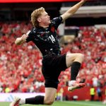 VANCOUVER, BRITISH COLUMBIA - JUNE 18: Jacob Shaffelburg #14 of Canada celebrates the team's fifth goal, an own goal by Mohamed Manai #26 of Qatar (not pictured), during the FIFA World Cup 2026 Group B match between Canada and Qatar at BC Place Vancouver on June 18, 2026 in Vancouver, British Columbia. Alex Grimm/Getty Images/AFP