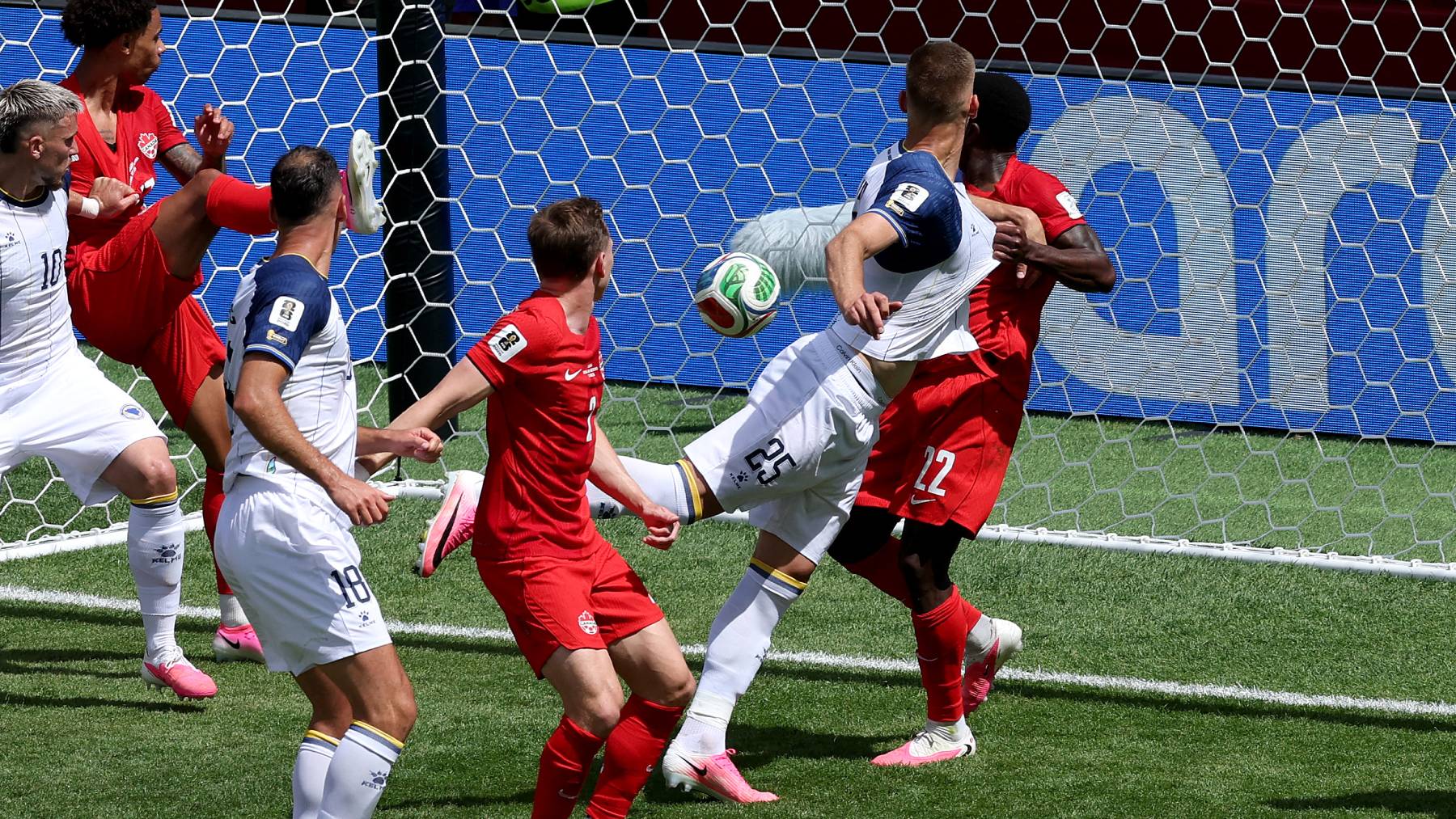 TORONTO, ONTARIO - JUNE 12: Jovo Lukic #25 of Bosnia and Herzegovina scores his team's first goal off a header during the FIFA World Cup 2026 Group B match between Canada and Bosnia and Herzegovina at Toronto Stadium on June 12, 2026 in Toronto, Ontario. Michael Steele/Getty Images/AFP