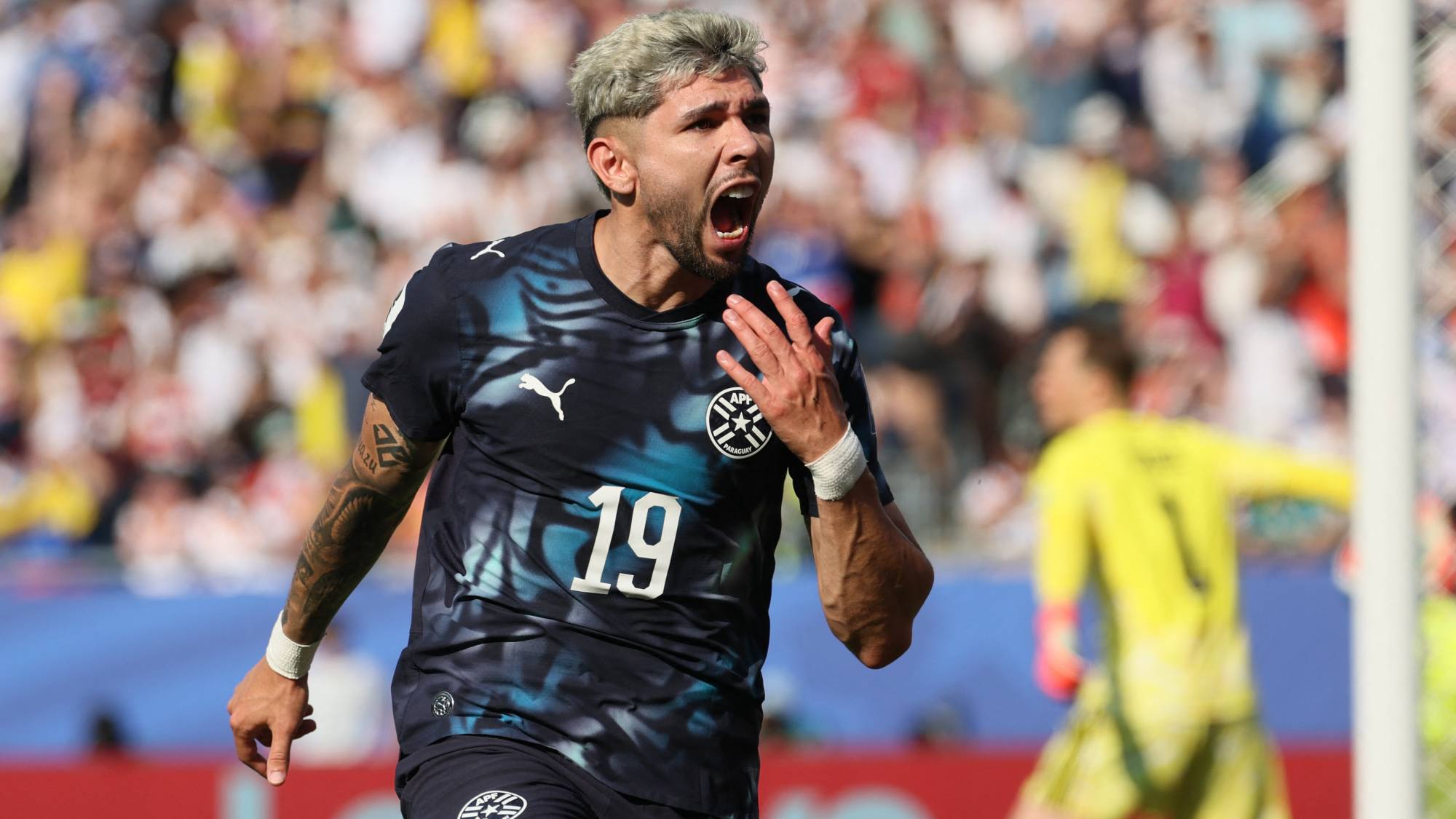 Paraguay's midfielder #19 Julio Enciso celebrates scoring his team's first goal during the 2026 World Cup round of 32 football match between Germany and Paraguay at the Boston Stadium in Foxborough on June 29, 2026.