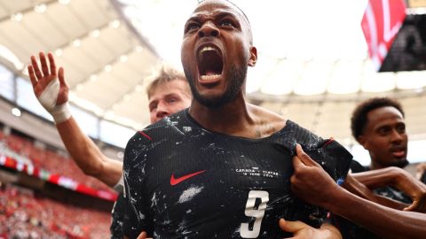 VANCOUVER, BRITISH COLUMBIA - JUNE 18: Cyle Larin #9 of Canada celebrates with teammates after scoring his team's first goal during the FIFA World Cup 2026 Group B match between Canada and Qatar at BC Place Vancouver on June 18, 2026 in Vancouver, British Columbia. Fran Santiago/Getty Images/AFP