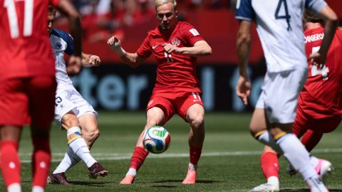 Bosnia-Herzegovina's forward #15 Amar Memic (L) fights for the ball with Canada's midfielder #11 Liam Millar during the 2026 World Cup Group B football match between Canada and Bosnia and Herzegovina at the Toronto Stadium in Toronto on June 12, 2026.