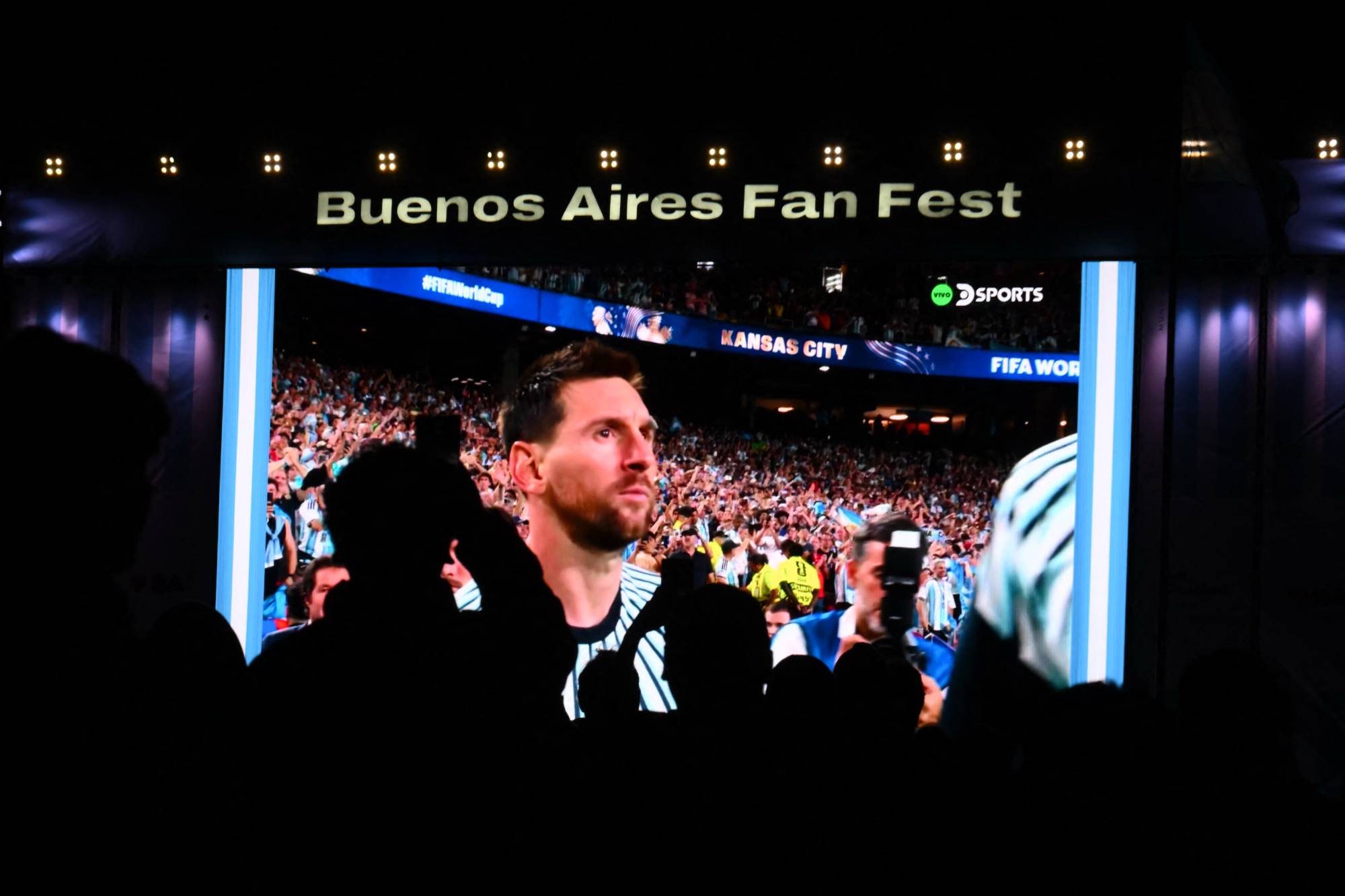 Fans watch on a giant screen, Argentina's forward Lionel Messi during the 2026 FIFA World Cup Group J football match between Argentina and Algeria, in Buenos Aires on June 16, 2026.