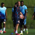 BOSTON, MASSACHUSETTS - JUNE 12: Sebastien Migne, Head Coach of Haiti, speaks with his players during the training and press conference of Haiti one day ahead of the FIFA World Cup 2026 Group C match between Haiti and Scotland at Boston Stadium on June 12, 2026 in Boston, Massachusetts. Mattia Ozbot/Getty Images/AFP