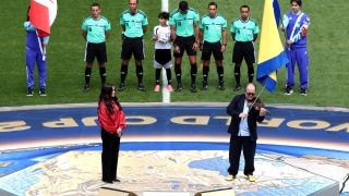 TORONTO, ONTARIO - JUNE 12: Alanis Morissette (L) performs the Canadian national anthem before the FIFA World Cup 2026 Group B match between Canada and Bosnia and Herzegovina at Toronto Stadium on June 12, 2026 in Toronto, Ontario. (Photo by Ezra Shaw - FIFA/FIFA via Getty Images)