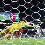 SANTA CLARA, CALIFORNIA - JUNE 22: (EDITOR'S NOTE: Image was captured using a remote camera from behind the goal.) Nadhir Benbouali #12 of Algeria scores his team's first goal past Yazeed Abulaila #1 of Jordan during the FIFA World Cup 2026 Group J match between Jordan and Algeria at San Francisco Bay Area Stadium on June 22, 2026 in Santa Clara, California. (Photo by Stu Forster/Getty Images)