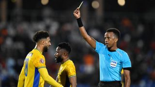 Gabon's forward #20 Denis Bouanga is shown the yellow card by Somali referee Omar Abdulkadir Artan during the Africa Cup of Nations (CAN) Group F football match between Gabon and Ivory Coast at the Grand Stadium in Marrakech on December 31, 2025. Award-winning Somali referee Omar Artan, set to be the first from his country to officiate at the World Cup, was denied entry to the United States, a sports ministry official told AFP on June 8, 2026. "Denying him entry to the United States and preventing him from officiating scheduled matches harms not only him personally but also undermines football's commitment to fairness, merit, and the spirit of fair play," Ciise Aden Abshir, a senior advisor to Somalia's Ministry of Youth and Sports and a former national team captain, told AFP.