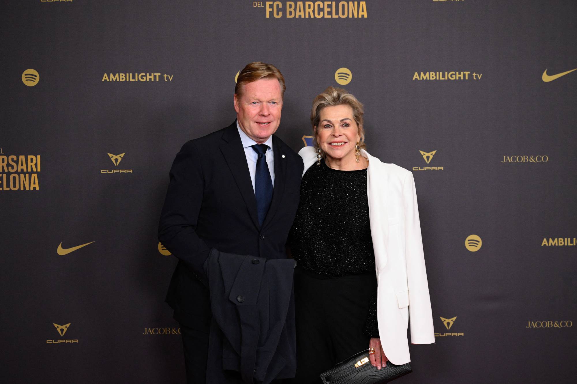 Former Barcelona player and coach Ronald Koeman (L) and his wife Bartina arrive to attend a gala in celebration of the 125th anniversary of the founding of FC Barcelona, in the Gran Teatre del Liceu theatre in Barcelona on November 29, 2024. 