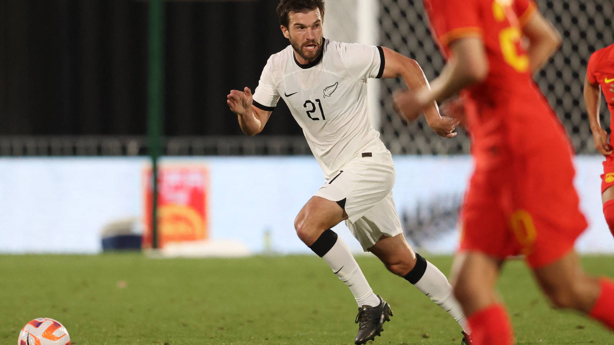 New Zealand's Tim Payne controls the ball during the football match between New Zealand and China at Mt Smart Stadium in Auckland on March 23, 2023.