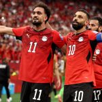 VANCOUVER, BRITISH COLUMBIA - JUNE 21: Mohamed Salah #10 of Egypt celebrates with Mostafa Zico #11 after scoring the team's second goal during the FIFA World Cup 2026 Group G match between New Zealand and Egypt at BC Place Vancouver on June 21, 2026 in Vancouver, British Columbia. Fran Santiago/Getty Images/AFP