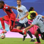 MIAMI GARDENS, FLORIDA - JUNE 21: Nuno da Costa #21 of Cabo Verde controls the ball under pressure from Sebastian Caceres #3 of Uruguay during the FIFA World Cup 2026 Group H match between Uruguay and Cabo Verde at Miami Stadium on June 21, 2026 in Miami Gardens, Florida. Alex Slitz/Getty Images/AFP