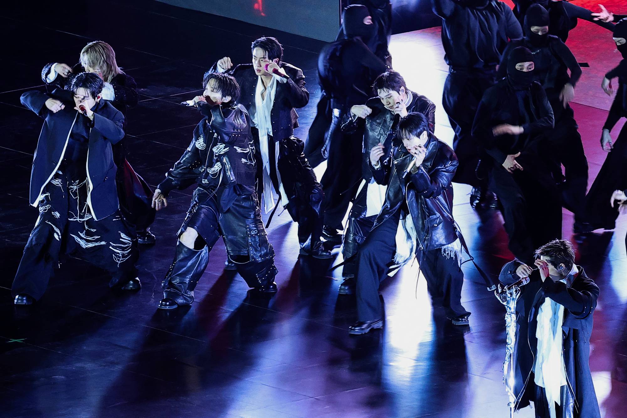 (From L to R) K-pop boy group BTS members V, Jimin, J-Hope, Jin, Suga, Jungkook and RM perform during their concert at Gwanghwamun Square in Seoul on March 21, 2026. South Korean megastars BTS reunite on March 21, for their first show in nearly four years, with an expected 260,000 fans taking over central Seoul for a K-pop extravaganza livestreamed to millions more worldwide.