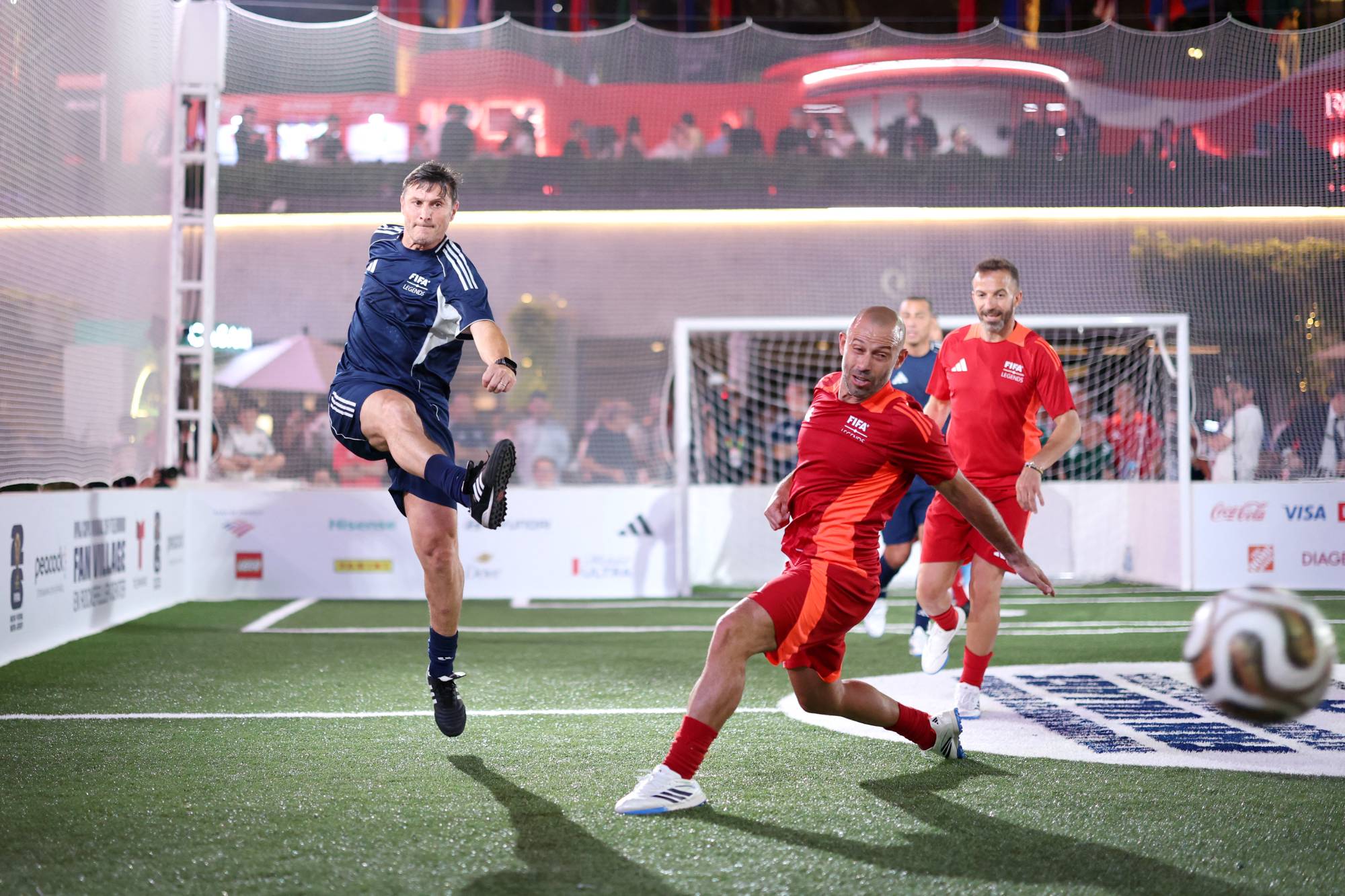 NEW YORK, NEW YORK - JULY 17: Javier Zanetti of FIFA Legends blue team shoots as Javier Mascherano of FIFA Legends red team attempts to block during the FIFA Legends Cup at Rockefeller Center on July 17, 2026 in New York City. Carl Recine/Getty Images/AFP