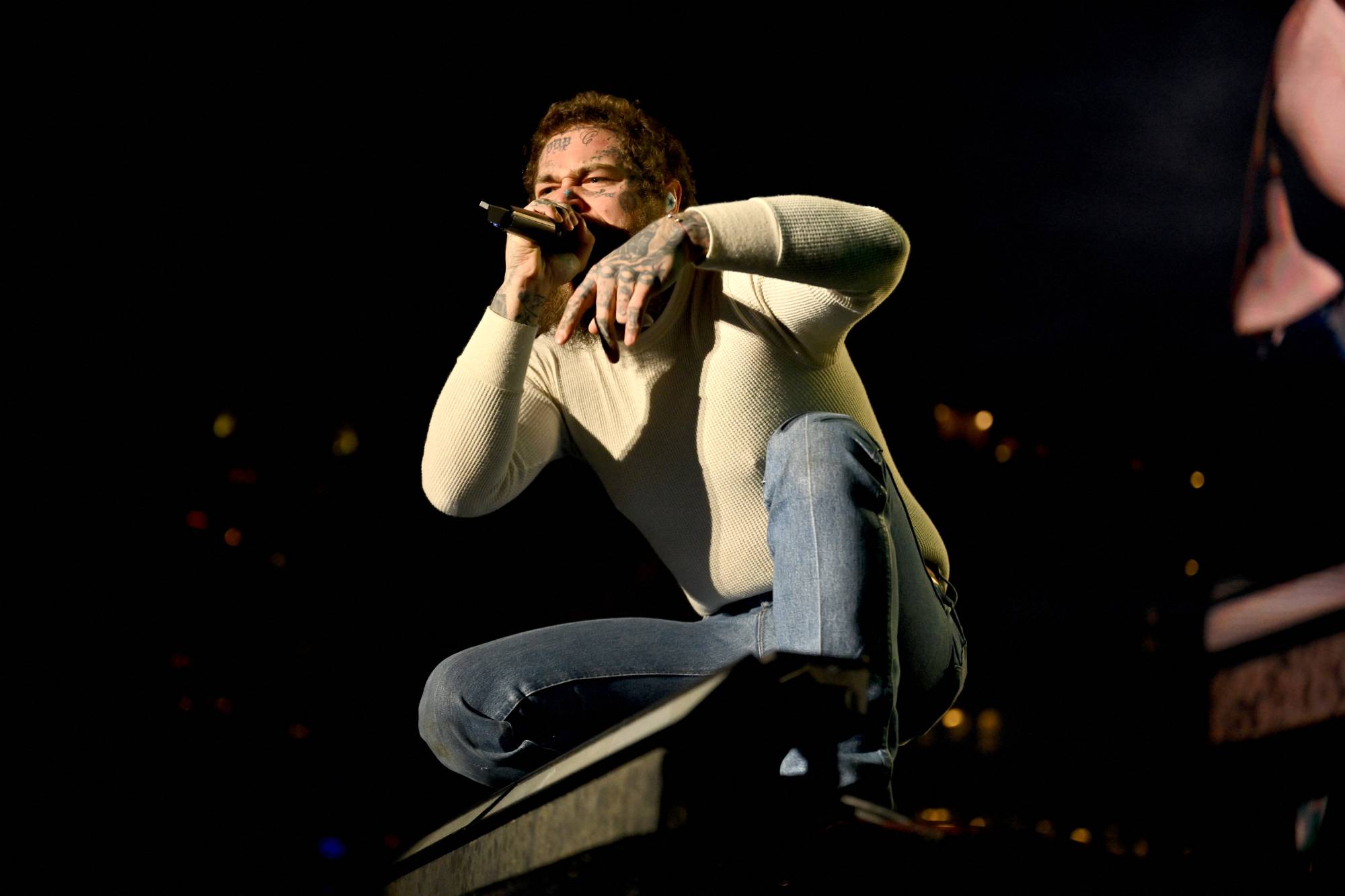 INDIANAPOLIS, INDIANA - APRIL 05: Post Malone performs onstage for the Capital One JamFest during the 2026 NCAA March Madness Music Festival on April 05, 2026 in Indianapolis, Indiana. Derek White/Getty Images for TNT Sports/AFP