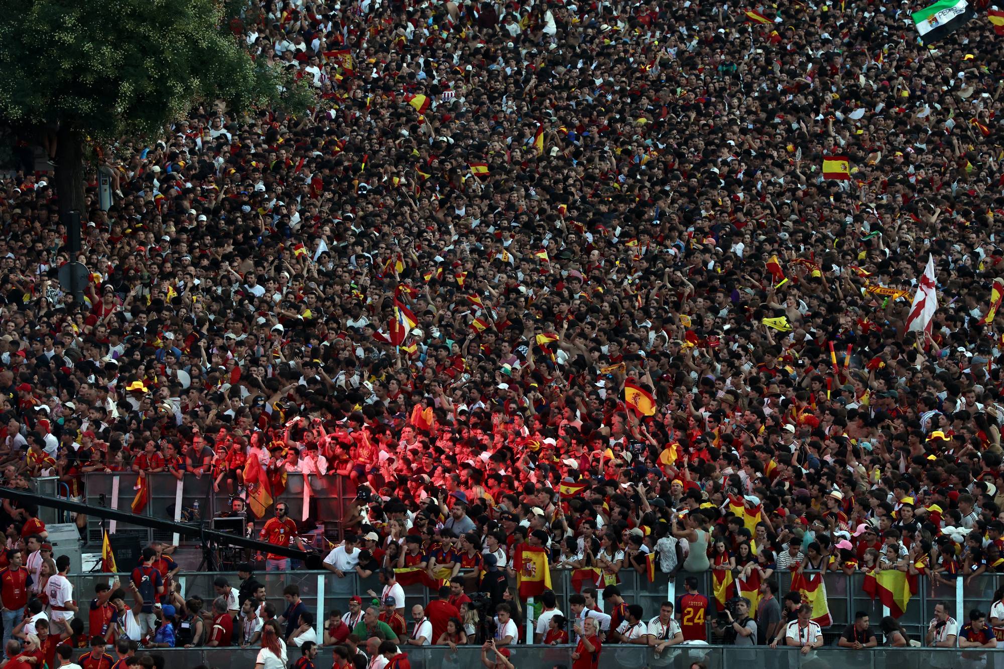 Spain fans pack Cibeles Square in Madrid on July 20, 2026, as they await the arrival of Spain's players one day after the national football team won their second World Cup title following a 1-0 victory against Argentina. Spain's World Cup winners come back home to a heroes' welcome in Madrid, where a million fans are expected to greet them after a night of raucous celebrations across the country.