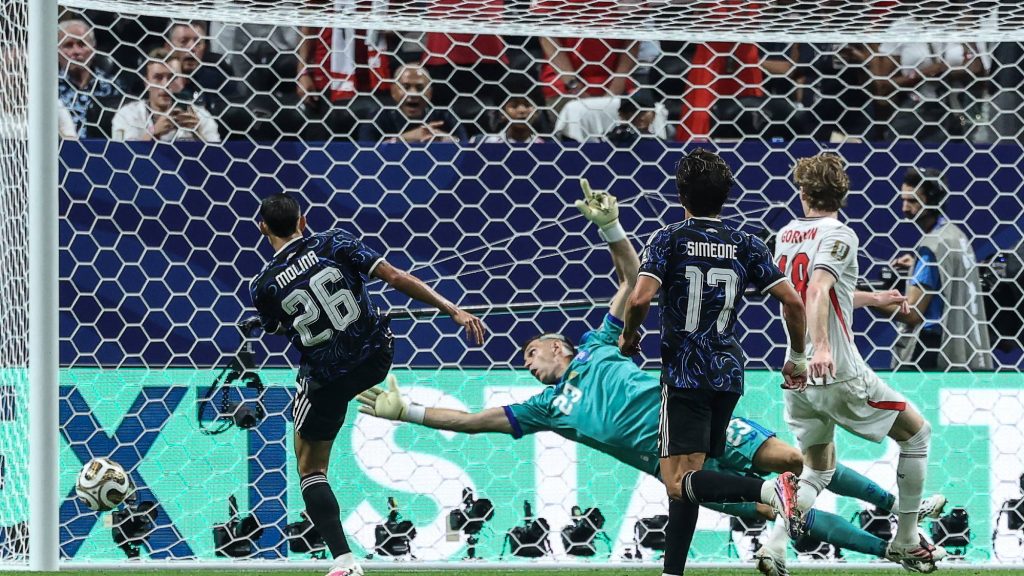 England's forward #18 Anthony Gordon shoots and scores his team's first goal during the 2026 World Cup football tournament semi-final match between England and Argentina at the Atlanta Stadium in Atlanta on July 15, 2026.